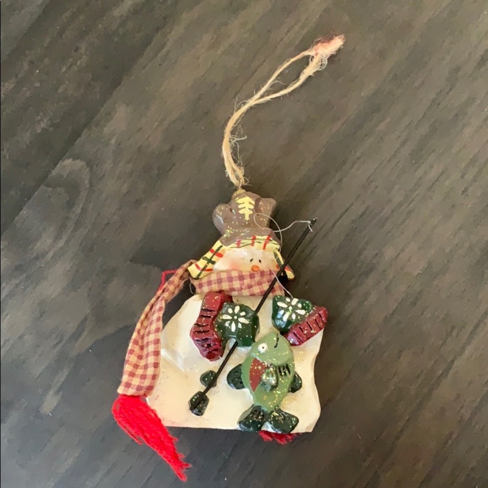 Christmas holiday ornament of fishing snowman